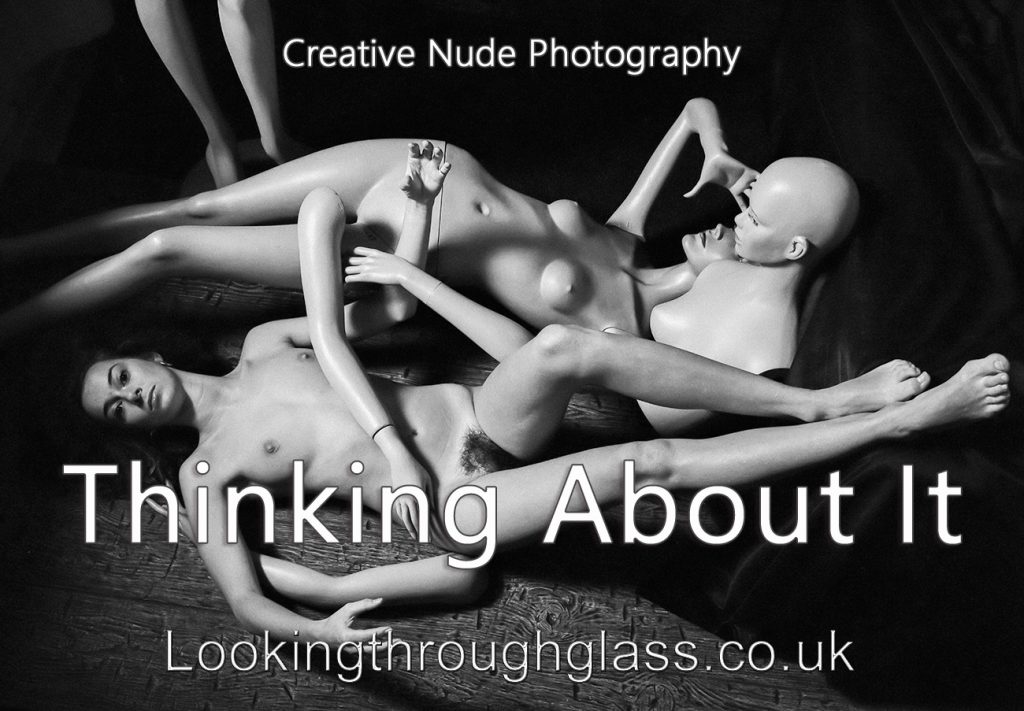 Creative nude photography Black and white photo of a nude woman and shop dummies