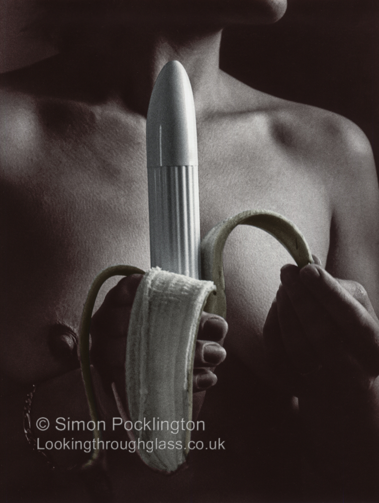 Nude woman peeling a dildo