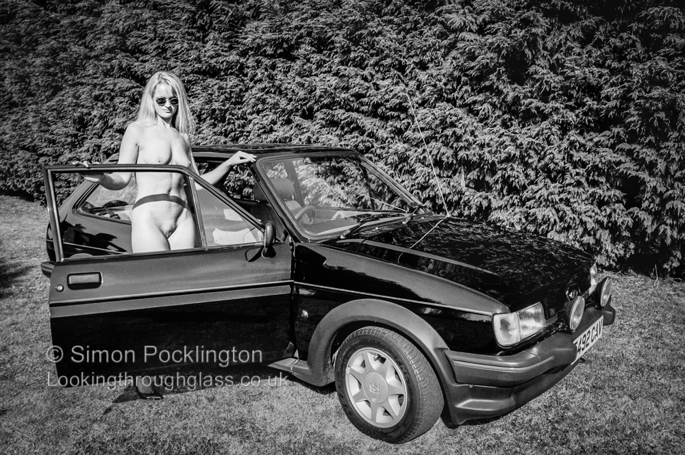 Naked portrait of a woman with her car. Naked portraits of women article